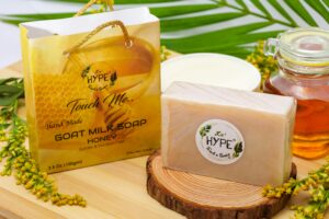 Elegant display of handmade goat milk soap with honey, surrounded by natural elements for an organic appeal.